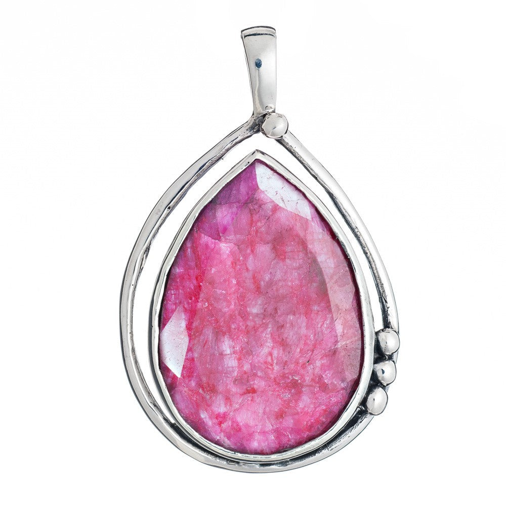 Introducing the Poppy Pendant Large in various gemstones by Gallardo & Blaine Designs, a teardrop-shaped piece featuring a vibrant pink gemstone encased in sleek sterling silver. The minimalist design includes three small silver accent beads on one side, adding a touch of elegance to the overall appearance.