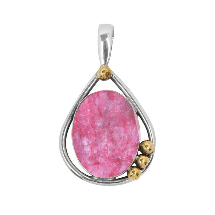 The Poppy Pendant Small in various gemstones by Gallardo & Blaine Designs showcases a teardrop-shaped pink gemstone set in a sterling silver frame with three small gold beads accenting the side. The pendant features a simple silver bail for attaching to a necklace.