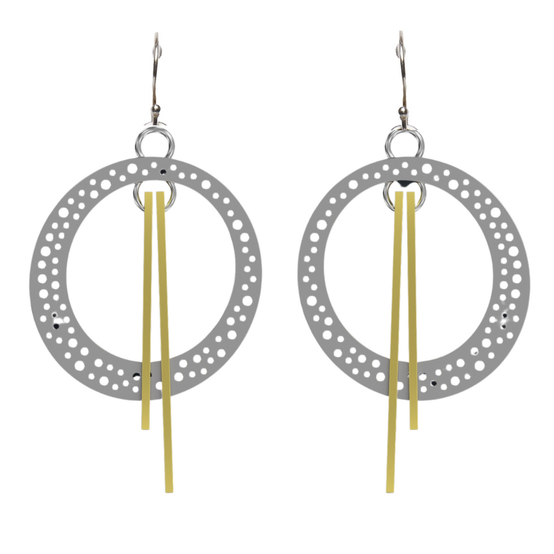 A pair of Rivera Earrings by Gallardo & Blaine Designs featuring circular, perforated metal hoops with long, straight, golden dangles in the center. The earrings have hooks at the top and a touch of Art Deco elegance.