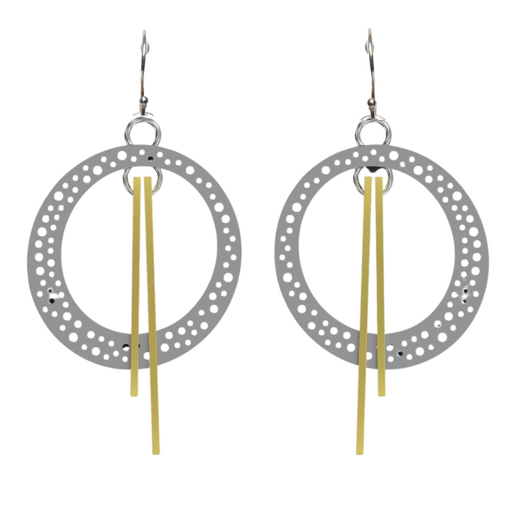 A pair of Rivera Earrings by Gallardo & Blaine Designs featuring circular, perforated metal hoops with long, straight, golden dangles in the center. The earrings have hooks at the top and a touch of Art Deco elegance.