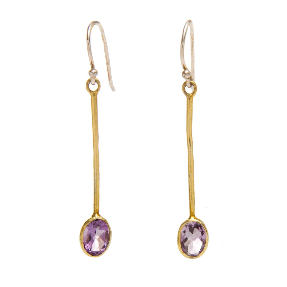 Introducing the Sequola Earrings in various gemstones by Gallardo & Blaine Designs: a pair of elegant, thin, gold drop earrings with oval-shaped, purple gemstones at the end. Each earring features a delicate hook for wearing. The sterling silver accents add to the sleek and minimalist design of these exquisite gemstone dangle earrings.