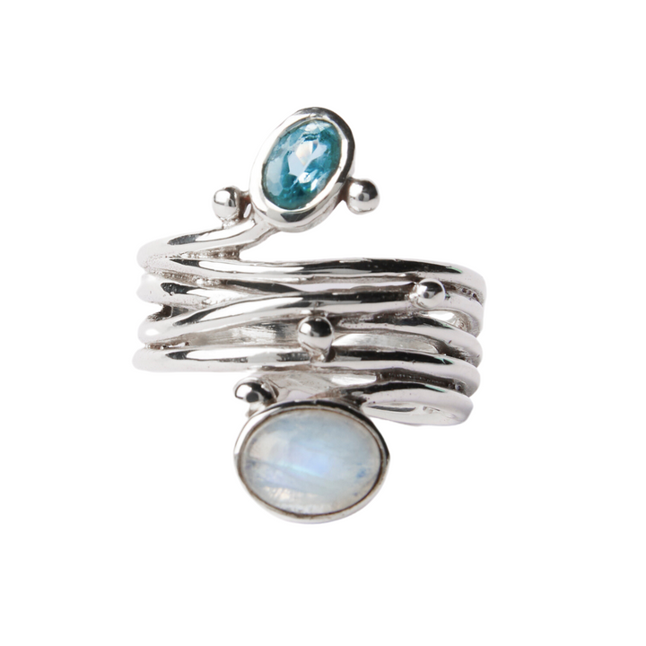 A Snake Ring in Silver Gold & various gemstones by Gallardo & Blaine Designs with a unique, multi-band design features two gemstones: an oval, translucent blue gemstone at the top and a larger, oval, iridescent stone at the bottom. Small silver accents embellish the asymmetrically arranged bands of this adjustable silver & gold ring.