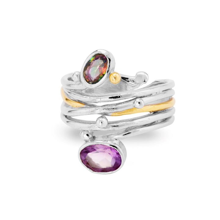 A unique Gallardo & Blaine Designs Snake Ring in Silver Gold & various gemstones featuring a multi-band design in silver and gold tones, adorned with two oval gemstones. The upper gemstone is multicolored, and the lower one is purple. Small silver beads accentuate the bands for an exquisite, textured look. This adjustable ring combines elegance with a distinctive flair.
