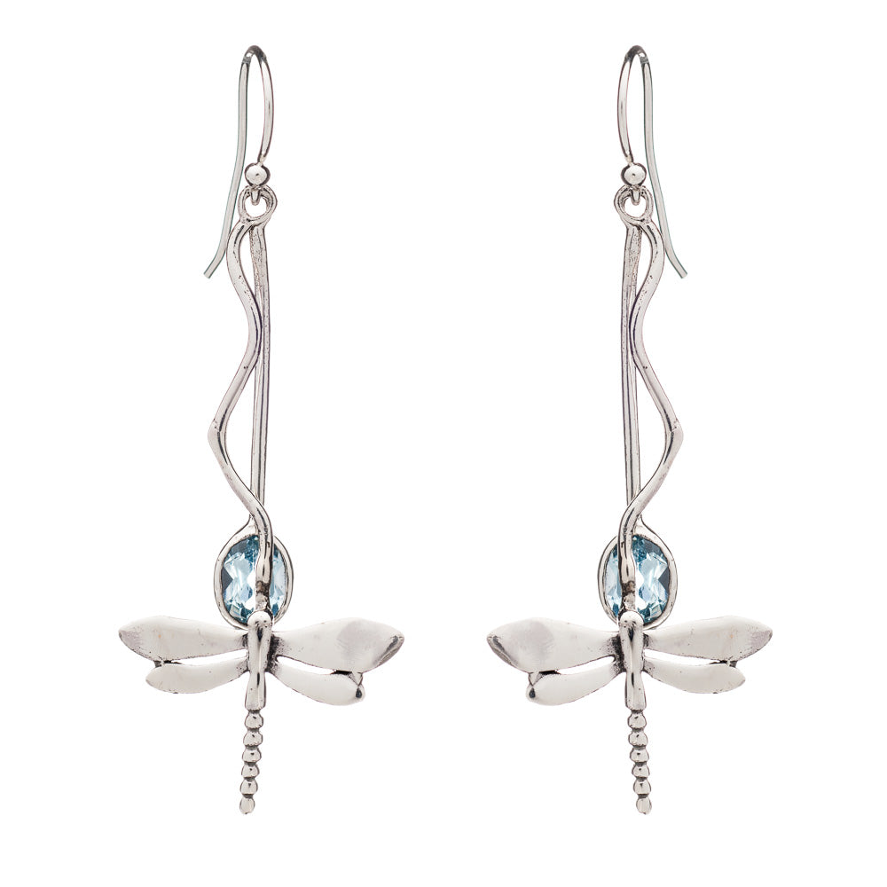 A pair of silver dangle earrings featuring intricate silver dragonfly designs. Each dragonfly is adorned with a light blue gemstone at its center, and the earrings have long, elegant hooks that resemble twisting vines. Introducing the Willow Earrings in Various Gemstones from Gallardo & Blaine Designs.