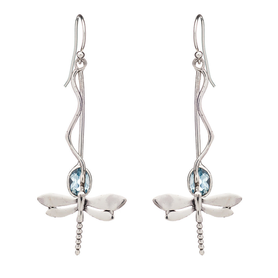 A pair of silver dangle earrings featuring intricate silver dragonfly designs. Each dragonfly is adorned with a light blue gemstone at its center, and the earrings have long, elegant hooks that resemble twisting vines. Introducing the Willow Earrings in Various Gemstones from Gallardo & Blaine Designs.