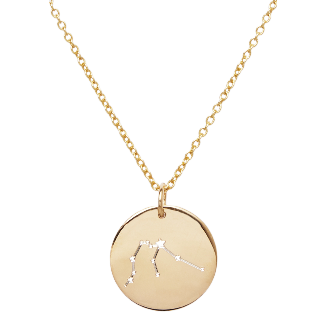 A Constellation Symbol Pendant with a round star sign pendant featuring a delicate engraving of a star constellation by The Collective Dublin. The chain is made of small interlinked loops, complementing the pendant's simple yet elegant design.