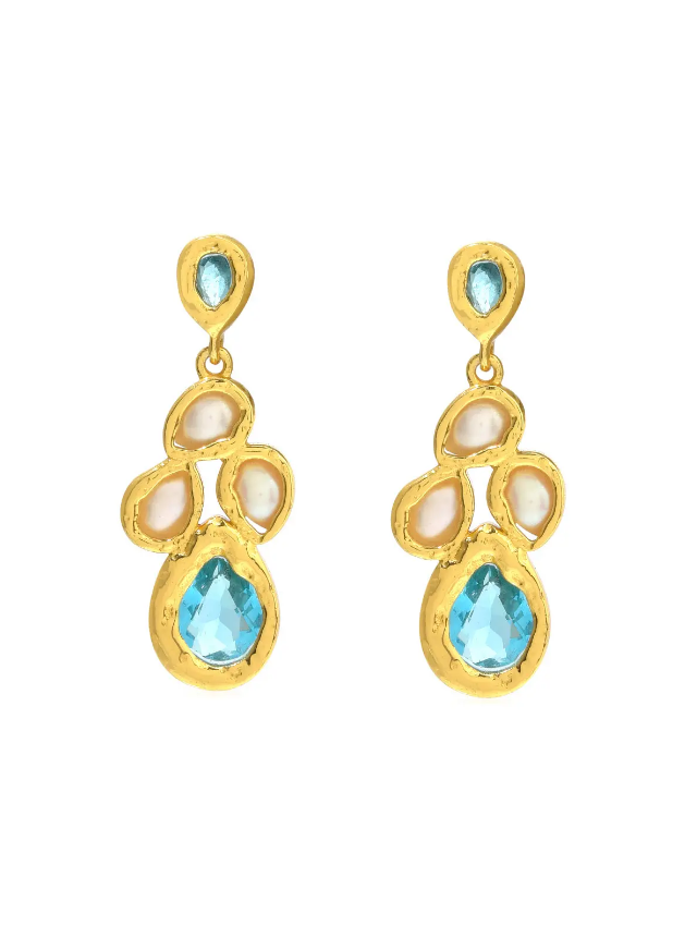 A pair of gold dangle earrings featuring light blue turquoise and small pearl inlays, shown on a plain white background.