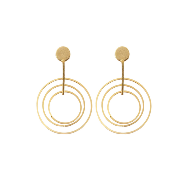 A pair of thick gold plate Kylie Gold Drop Circle Earrings from Watermelon tropical featuring a small round stud with a long post. The post supports three concentric circles of increasing size, reminiscent of sixties style dangling hoops, creating a modern, geometric design.