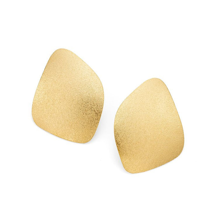 A pair of Freeform Wing Studs Gold by Leoma Drew with a textured, frosted finish. Each earring features a smooth, irregularly-shaped surface, giving them a modern, artistic appearance. Set against a plain white background.