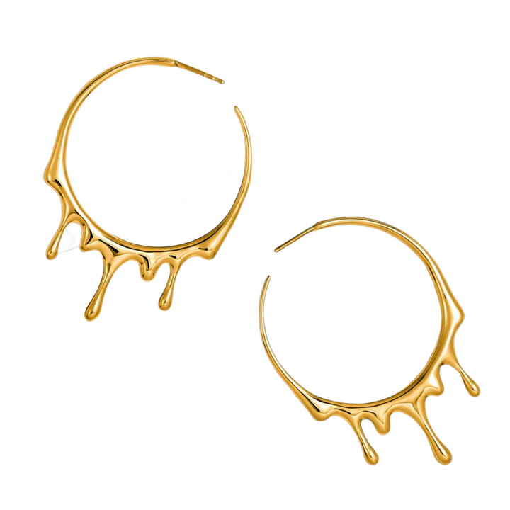 A pair of Marie June Jewellery Gold Dripping Circular M Hoop Earrings, crafted in 18K yellow gold, designed to appear as though molten metal is dripping from the bottom. The earrings have a polished finish, giving them a shiny, reflective surface.