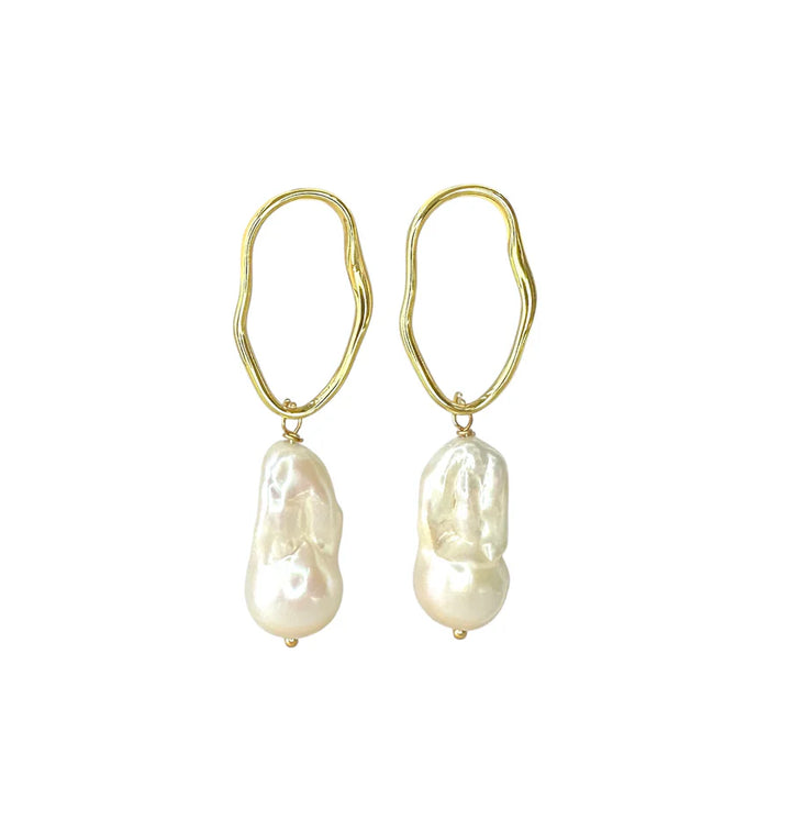 Millie Earrings in various colours by Aria V: handmade gold earrings with irregular wavy hoops and large, unique baroque pearls—ideal for lovers of distinctive freshwater pearl jewelry. Shown on a white background.