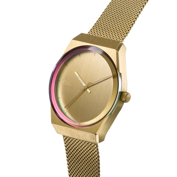 A gold wristwatch with a minimalist, brushed metal face and no numerals. The Storm Mini Cirero Gold, part of the Storm Watches collection, has a stainless steel mesh strap and a multi-colored, iridescent edge on the glass cover.