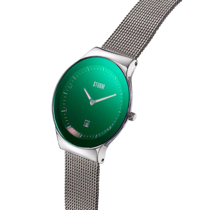 A sleek Storm Watches Storm Mini Sotec Lazer Green with a stainless steel mesh strap featuring a circular face with a green gradient background. The watch has minimalist hour markers, silver hands, a small date display at the 6 o'clock position, and the brand name "Storm Watches" written below the 12 o'clock marker.