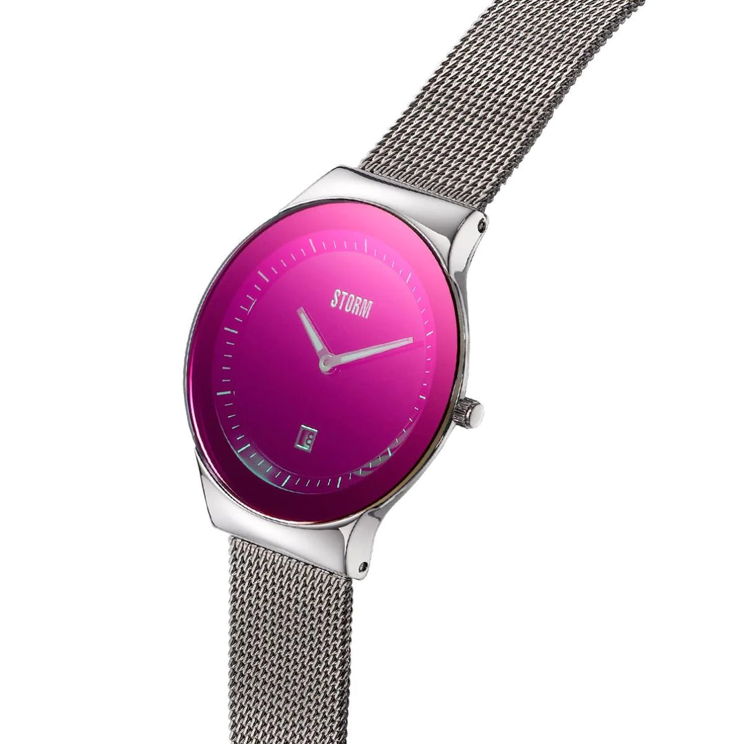 A stylish wristwatch with a silver mesh band and a glossy purple face, the Storm Mini Sotec Lazer Purple displays analog time with thin, silver hour and minute hands. The brand name "Storm Watches" is visible in silver at the top center of the watch face, crafted from sustainable materials.