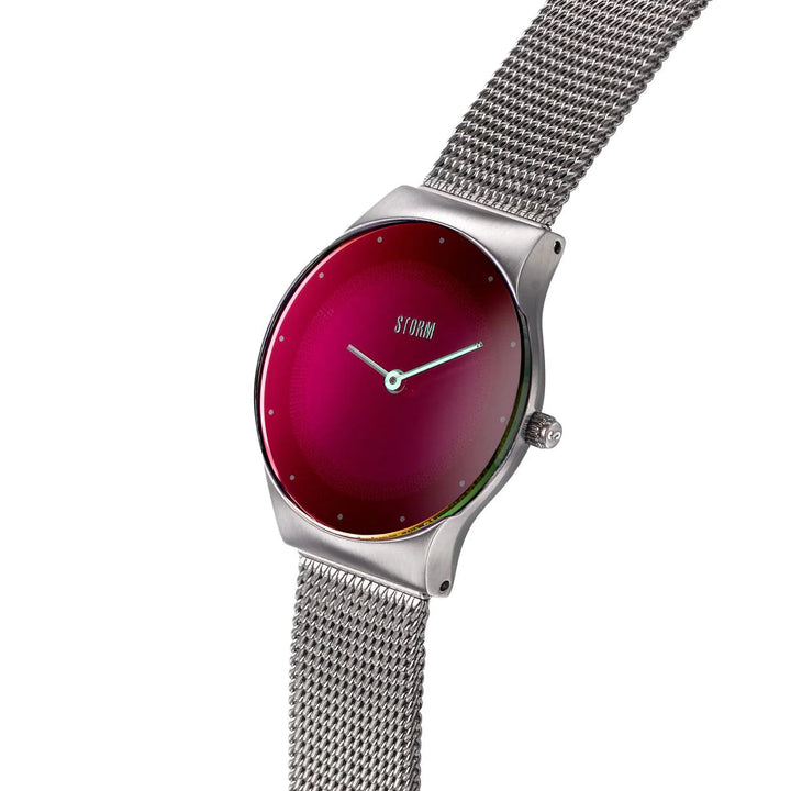 A sleek wristwatch with a silver mesh band and a minimalist red and black gradient face. The dial, known as the Storm Mini Terelo Lazer Purple, has small, barely visible hour markers and the brand name "Storm Watches" at the 12 o'clock position—crafted with sustainable materials for an eco-friendly touch.