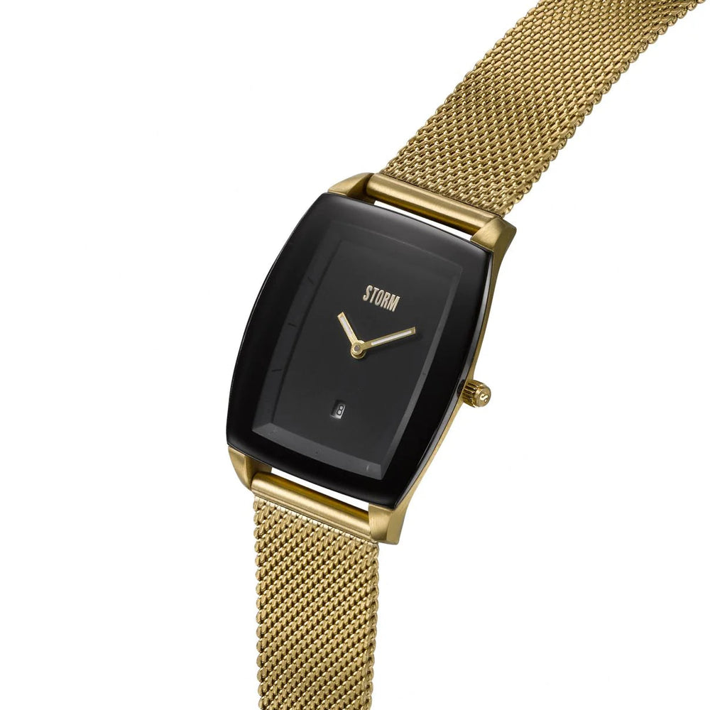 The Storm Mini Zaire Gold Black wristwatch by Storm Watches features a gold mesh strap and a black rectangular face with minimalist gold hour and minute hands, a small date window, and the brand name "STORM" in gold text. Crafted using sustainable materials, this timepiece boasts a sleek, modern design.