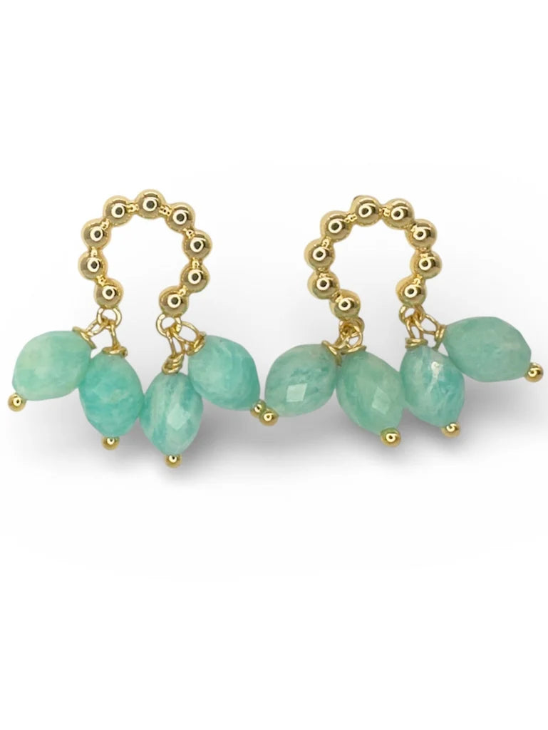 Mirage Earrings by Aria V are gold hoops adorned with decorative beading, each featuring five dangling faceted aqua-green Amazonite gemstone drops. Handcrafted in Dublin, these artisanal earrings add a unique touch to any ensemble.
