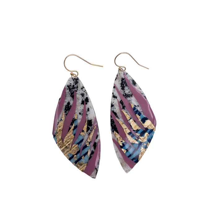 The Peitil Batik Textile Earrings in Charcoal/Deep Rose/Lapis Gold by Rothlú are a unique pair of drop earrings shaped like leaves with an abstract design. These one-of-a-kind earrings boast a mix of colors including white, black, purple, blue, and gold accents. Enhanced by a high gloss eco resin sheen and batik techniques, the gold-toned hooks complete this stunning look.