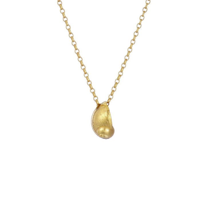 The Periwinkle Shell Necklace by Jennifer Kinnear features a delicate gold chain adorned with a small, smooth baby sea snail pendant. The pendant's organic, asymmetrical shape imparts a unique and natural appearance, while the evenly spaced chain links add an elegant touch to this Silver & Gold Plated piece.