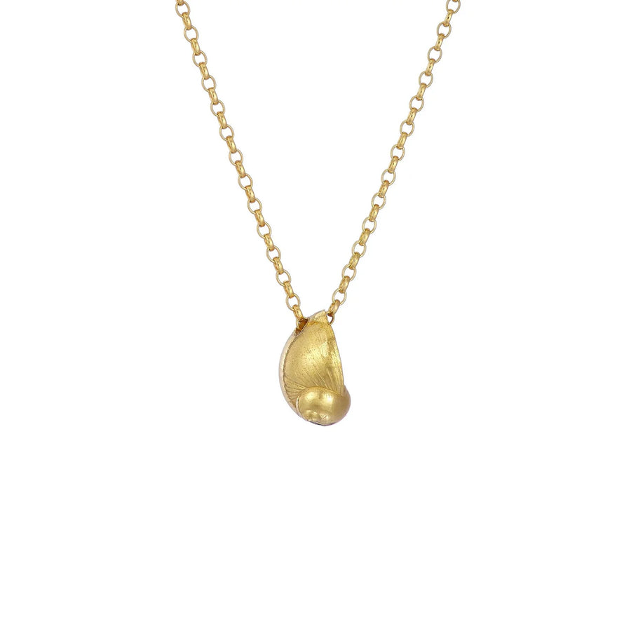 The Periwinkle Shell Necklace by Jennifer Kinnear features a delicate gold chain adorned with a small, smooth baby sea snail pendant. The pendant's organic, asymmetrical shape imparts a unique and natural appearance, while the evenly spaced chain links add an elegant touch to this Silver & Gold Plated piece.