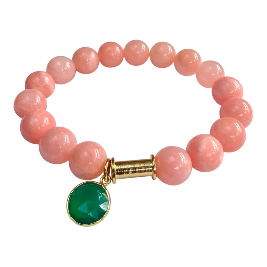 The Soulstone Pink Chalcedony and Green Onyx Bracelet by Aria V is handmade in Dublin, featuring delicate pink chalcedony beads accented with gold and a faceted round green onyx charm.