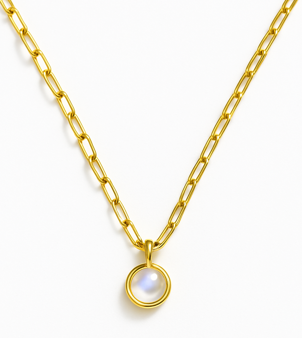 The Watermelon tropical Rainbow Moonstone Round Drop Necklace features a gold chain with elongated links and a round, iridescent moonstone pendant set in a gold bezel—an elegant piece of handmade jewellery on a white background.