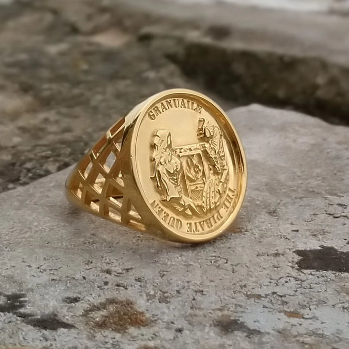 The Jennifer Kinnear Grace O'Malley Sovereign Ring features an engraved gold round face with "GRANVILLE" and "THE DRIFT QUEEN" displayed on a rough stone surface.