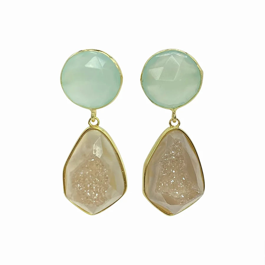 A pair of elegant Sahara Earrings by Aria V featuring round, faceted pale green stones on the top, connected to irregularly shaped, faceted light brown stones with a textured center. The stones are set in 16-carat gold-toned metal.