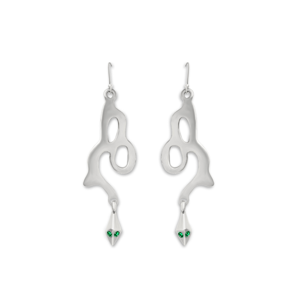 Add a unique touch to your collection with Serpent Earrings by Madeleine Sculptural Jewellery—silver earrings featuring abstract, flowing shapes and dangling tips adorned with two green gemstones, evoking the look of snake eyes.