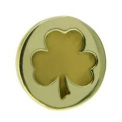 A solid brass lapel pin featuring a cut-out design of a shamrock in the center. The pin surface is smooth and shiny with high quality metal lacquer, symbolizing good luck. This is the Shamrock Lapel Pin by Millett Wade.