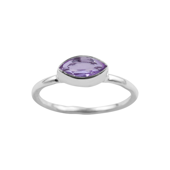 A sleek Silver Marquise Amethyst Ring featuring a prominent cushion-cut purple gemstone in the center. The gemstone is set in a simple bezel setting, and the band is smooth and polished. This exquisite piece is from Watermelon Tropical.