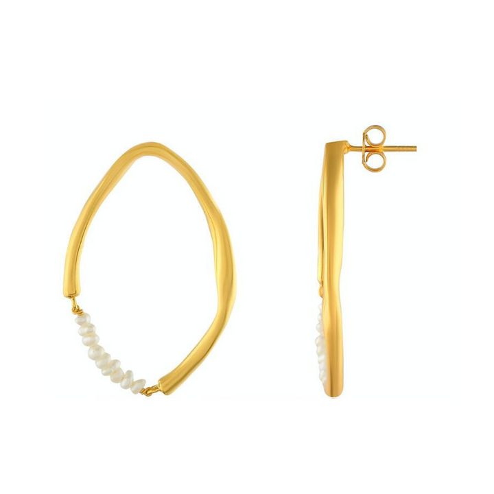 The Shyla Thiva Earrings are a pair of elegant gold hoop earrings made from 22 carat gold with an irregular, slightly twisted shape. Each earring is embellished with small white pearls along part of the lower half. One earring is shown front-facing, and the other is displayed side-on against a white background.