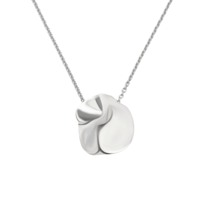 The Tide Necklace by Madeleine Sculptural Jewellery is a silver handmade piece with a delicate chain and a polished, abstract pendant featuring smooth, organic folds, shown on a plain white background.
