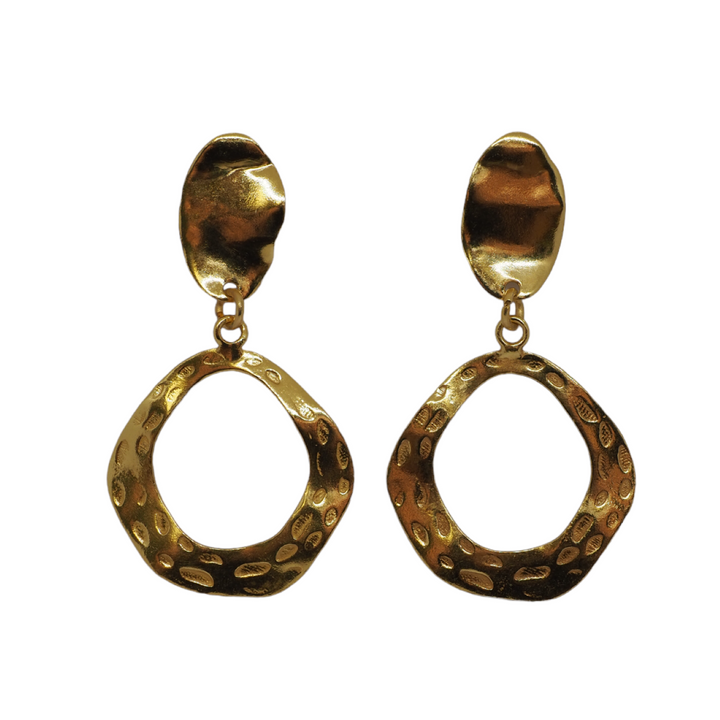 These earrings are gold plated and have an elegant, organic design. The upper portion is an irregular, slightly concave oval with a textured, hammered finish that reflects light beautifully. Suspended from the top stud is a hollow, asymmetrical, open hoop with a wavy, freeform shape. The hoop also features a hammered texture with small, circular indentations, adding depth and visual interest.