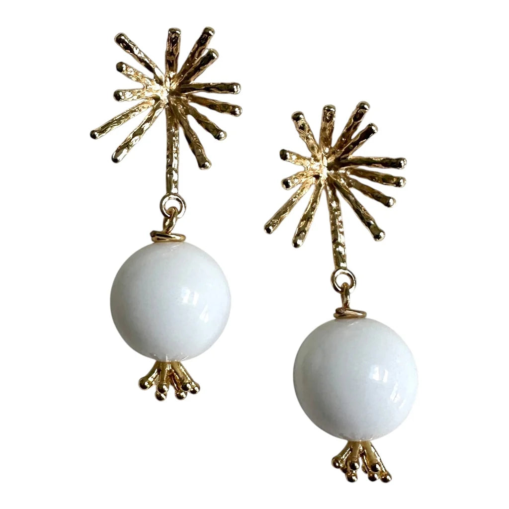 The White Bloom Earrings by Aria V feature gold plated studs adorned with starburst designs and round white chalcedony beads that dangle below, each finished with delicate gold accents—making these handmade earrings a stunning addition to any jewelry collection.