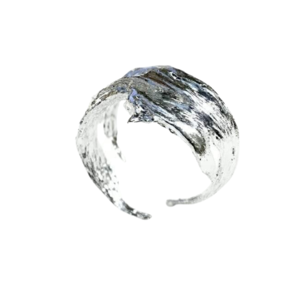 A close-up image of an artistic, silver-colored Woodland Bark Ring Silver with a textured, irregular surface resembling brush strokes. The open band, displayed against a plain white background, suggests it may be adjustable. This piece by Caroline Stokesberry-lee is made to order for those who appreciate the beauty of nature.