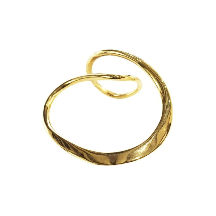 A shiny, gold, abstract-shaped **Infinity Ring Gold** with a smooth and slightly twisted design. Crafted by a master craftsman of art at **Lotta et Djossou**, this piece features a loop that curves around, creating an elegant and modern appearance against a white background.