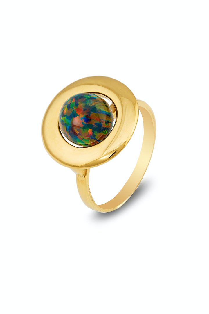 A gold ring featuring a round setting with a mesmerizing, iridescent black opal stone at its center. The ring's band is smooth and polished, beautifully complementing the vibrant hues of the opal, which displays a mix of green, blue, red, and yellow tones. This exquisite piece is none other than the Home Planet Black Opal 9ct Gold from Cosmic Boulevard.