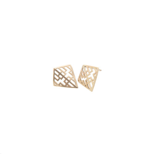 A pair of Miriam Wade Auriga Stud Earrings 9ct Yellow Gold with a geometric cut-out pattern reminiscent of the Auriga constellation. The triangles have a slightly curved, smooth surface, forming a lattice-like structure. One earring faces front while the other shows its side profile.