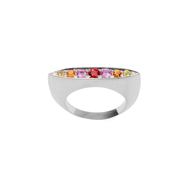 A modern sterling silver ring featuring a band of multicolored sapphires, including yellow, pink, and red stones. The sleek and minimalist design showcases the gemstones set elegantly in the top center. This is the Morningstar Sapphire Ring from Cosmic Boulevard.