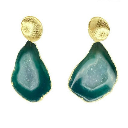 A pair of elegant, handmade in Ireland, green geode agate Ileanna Earrings by Aria V featuring an oval textured, 24k gold-plated stud attached to a teardrop-shaped green geode stone with gold trim. The geode has a darker green outer edge and a lighter, sparkling center.