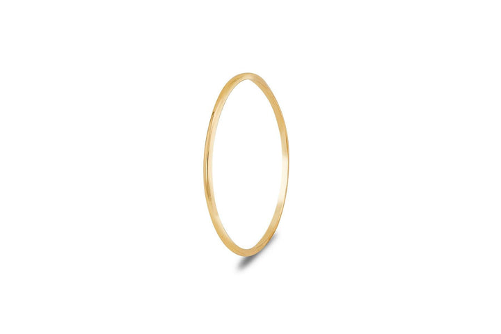 A **Cosmic Thread 9ct Gold Stacking Ring** from **Cosmic Boulevard** is displayed against a white background. The simplicity of the smooth, polished surface highlights its elegant and minimalist design, reminiscent of the craftsmanship found in Dublin Studio's handmade jewellery collection.