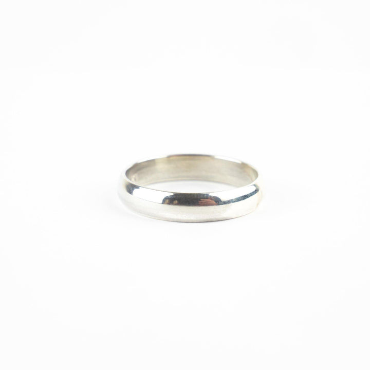 A plain, simple Engravable Simple Sterling Silver Band by Engravable Jewellery on a white background. The ring features a smooth, polished surface with a slightly rounded shape and no additional adornments, perfect for custom engraving.