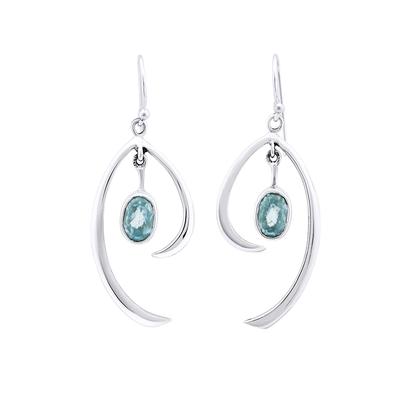 A pair of Gallardo & Blaine Designs Primrose Earrings in various gemstones featuring sterling silver and an elegant, flowing design with teardrop-shaped blue gemstones at their center. These earrings have a hook for wearing and showcase modern, minimalist elegance.