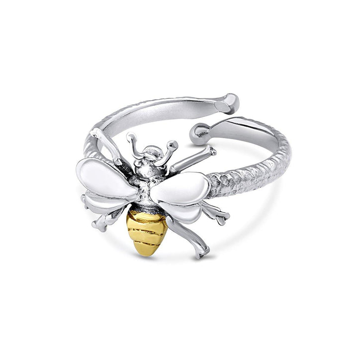 A bestselling Wildlife Bee Ring Silver & Gold, this silver open-ended design by Gallardo & Blaine Designs features a decorative bee with white enamel wings and a yellow and black striped body, detailed with fine lines for a realistic look. The adjustable ring band is textured with a slight hammered finish.