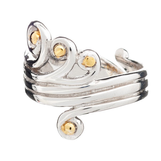 A **Crown Ring** with a swirling, intricate design featuring several small, round, gold vermeil accents. The adjustable sterling silver ring by **Gallardo & Blaine Designs** showcases a blend of silver and gold elements, creating an elegant and ornate appearance.