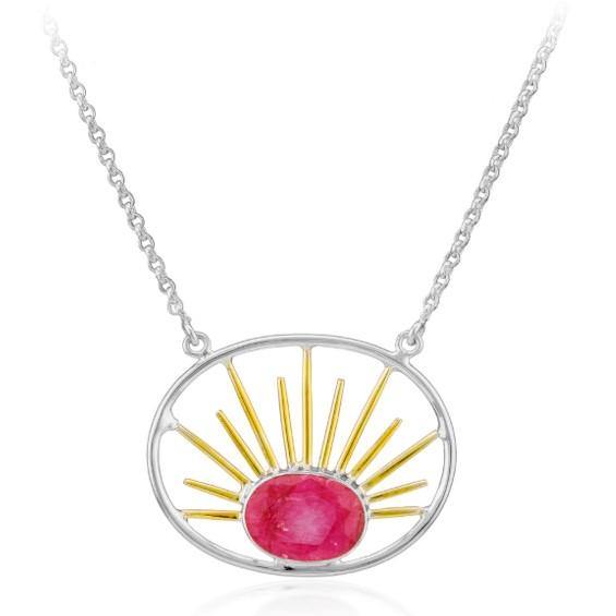 A silver necklace featuring an oval stone pendant with a central pink gemstone. The pendant boasts an open design with gold vermeil rays radiating from the gemstone, creating a stunning sunburst pattern. The simple silver chain complements and enhances the pendant's elegant design, much like the Goddess Necklace Large in Various Gemstones by Gallardo & Blaine Designs.