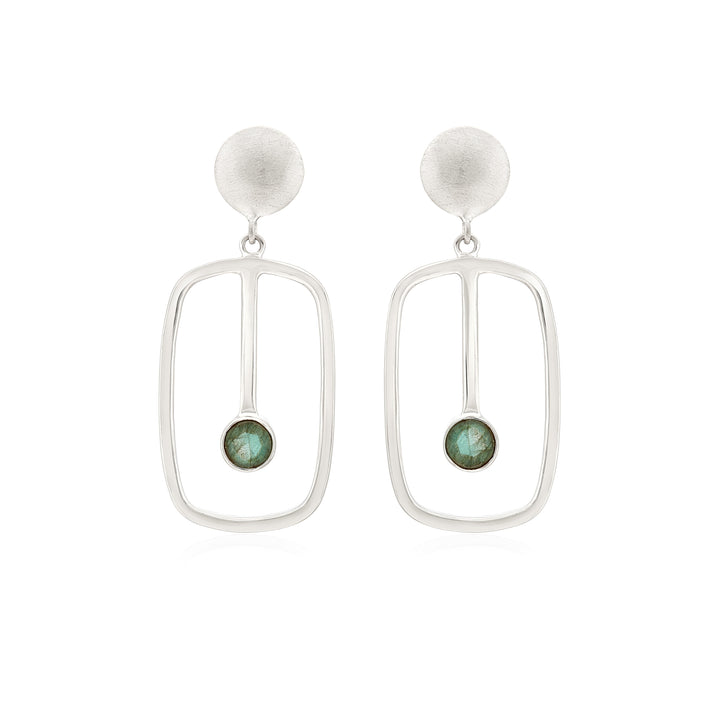 A pair of silver Lorelei Earrings Small in various gemstones by Gallardo & Blaine Designs featuring an oval-shaped design with a small green stone encased at the bottom center of each earring. The design has a modern, minimalist aesthetic.