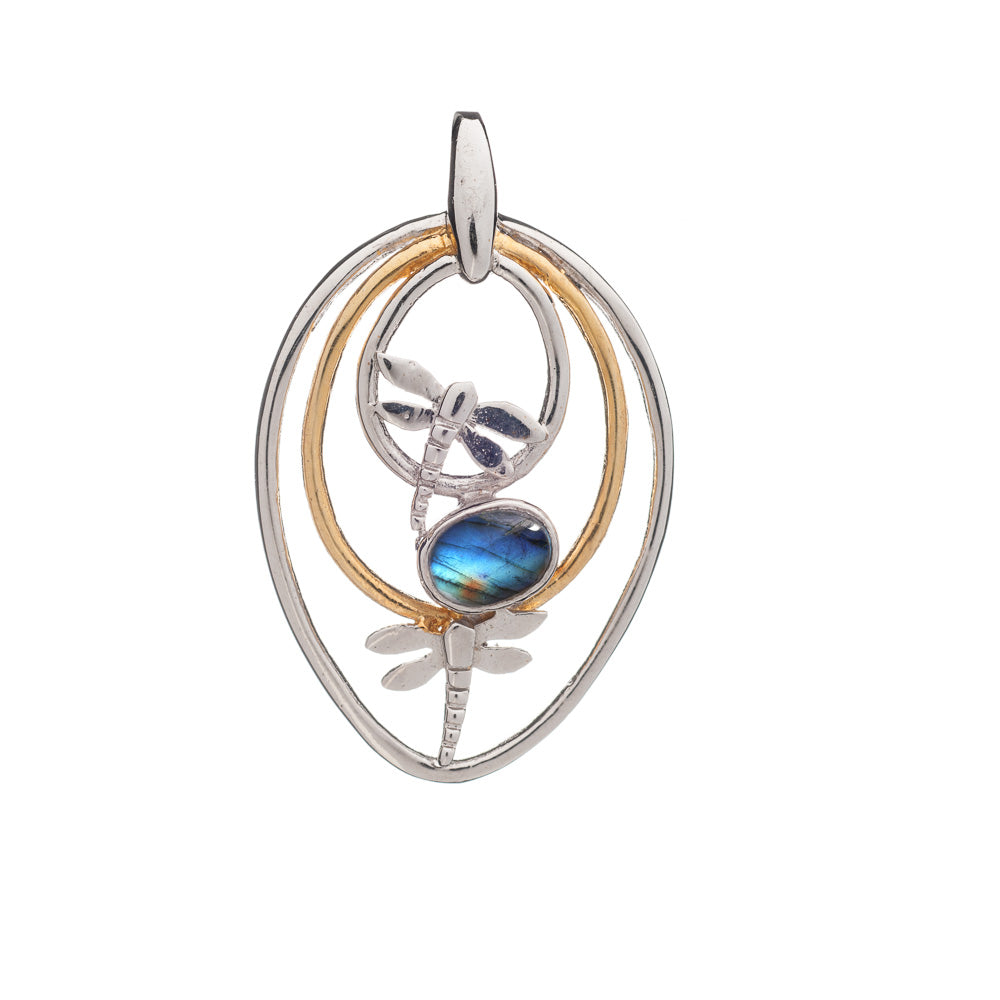 The Ripple Pendant by Gallardo & Blaine Designs features an oval silver shape with gold-plated accents, two dragonflies encircling a central iridescent gemstone, and a delicate nature-inspired design.