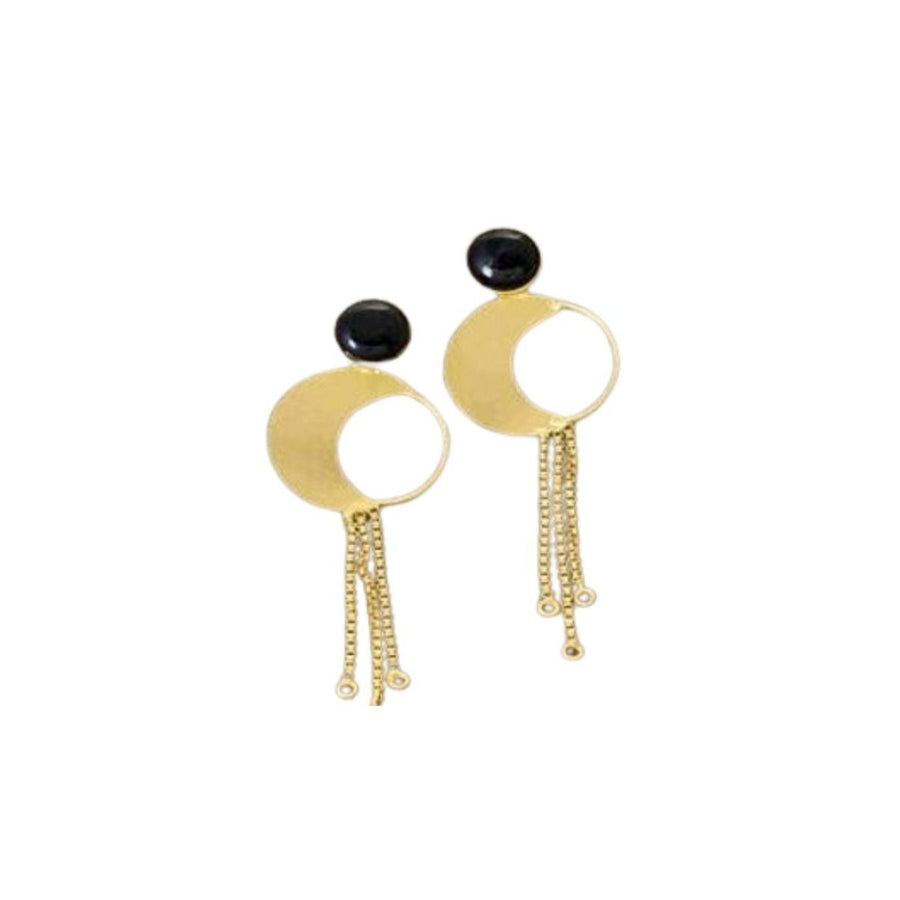 The Black Onyx Gold Chain Dangles by Watermelon tropical are a pair of handmade gold vermeil earrings featuring a circular design with an open half-moon shape. Each earring has a black stone at the top and three dangling gold chains hanging from the circular part, ending with small bead details. Beautiful jewellery that makes a statement.